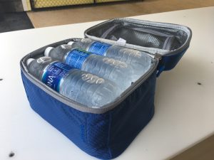 cooler with water bottles inside