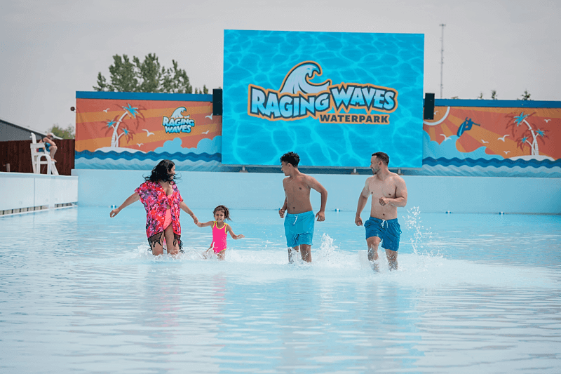 family running in the wave pool